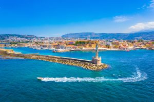beautiful city of Chania with its old harbor and the famous lighthouse Crete iStock 1156735604